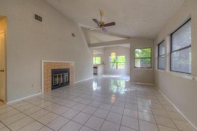 Unfurnished living room with vaulted ceiling, lig