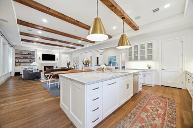 The kitchen overlooks the breakfast area and the living room. The wet bar is just to the right of the breakfast area.