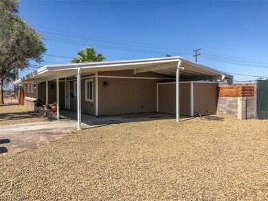 Carport and new rock landscaping.