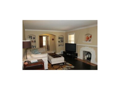 A large living room with a gas fireplace