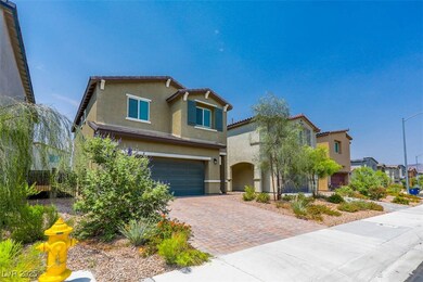 View of front of home with stucco siding, decorati