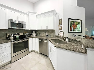 Kitchen featuring stainless steel appliances, a pe