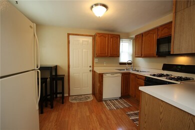 Another View of Eat-in Kitchen with Door that lead
