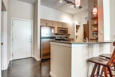 This peninsula has a granite countertop that also 