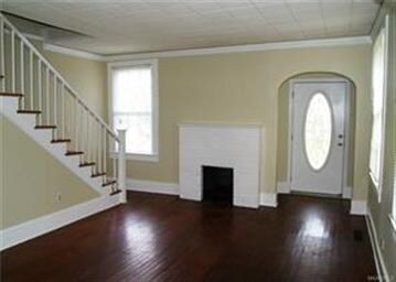 Spacious living room with fireplace and classic ha