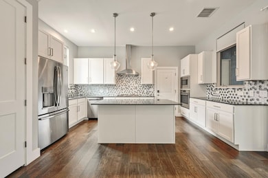 Kitchen featuring a kitchen island, visible vents
