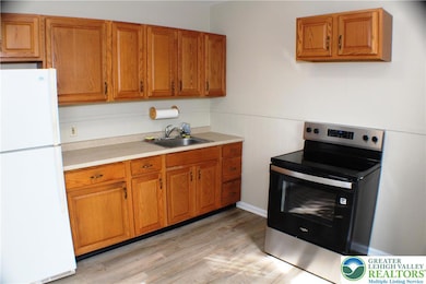 Large eat-in kitchen new stove, fridge included, but no dishwasher.  You could get a convertible dishwasher if you've got to have one