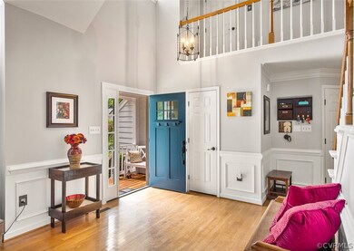 Stunning entry with vaulted ceiling, hardwood floo