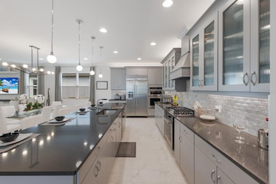 LARGE & long kitchen area very appealing & offers lots of room for cooking & kitchen items