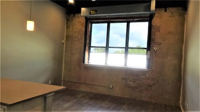Misc room with wood-type flooring