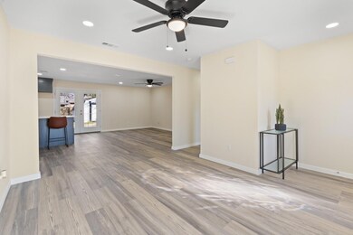 Unfurnished living room with ceiling fan, wood-typ