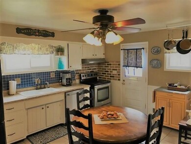 A true eat-in kitchen with access to the side yard