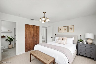 Bedroom with a chandelier, tile flooring, a closet