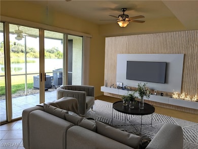 Tiled living room with a water view, a wealth of n