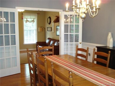Spacious Formal Dining Room with Chair Rail and Cr
