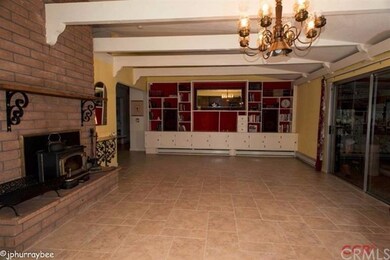 Built-in bookcases line the far wall. Sliding door