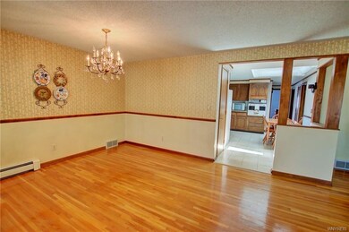 Formal Dining Rm w/crystal style chandelier + chai