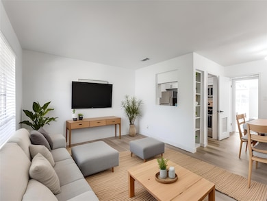 Living area featuring light wood-style floors and