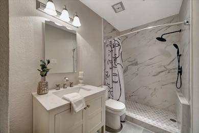 Step into this beautifully remodeled bathroom, fea