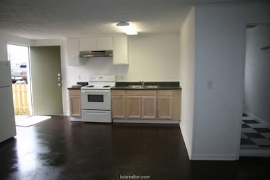 Kitchen with white appliances, under cabinet range
