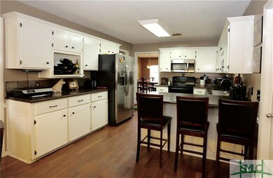 Kitchen with stainless steel appliances and breakf