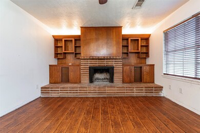 Beautiful wood built in shelving surround the gas