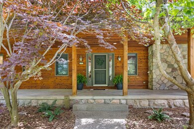 Beautiful trees frame the front door