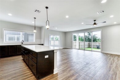Kitchen featuring recessed lighting, light counter