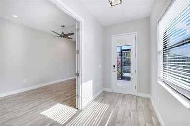 Foyer entrance with light hardwood / wood-style fl