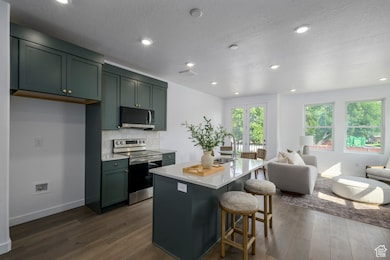 Whether it’s a quick breakfast or dinner with friends, this kitchen makes it easy. *model home