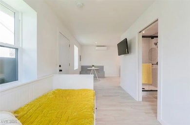 Hall featuring plenty of natural light, light wood
