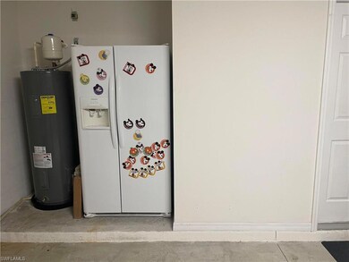 Detailed view of white refrigerator with ice dispe