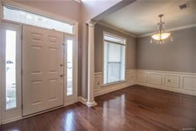 Hardwood flooring in the foyer and formal dining