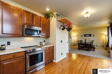 All nearly new stainless steel KitchenAide appliances. Sliding glass door leads to deck