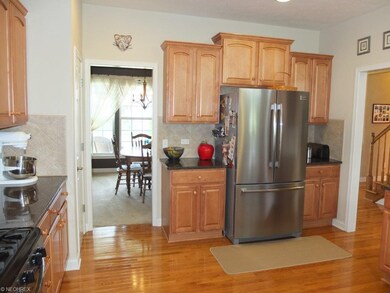 Kitchen has granite countertops and pantry.