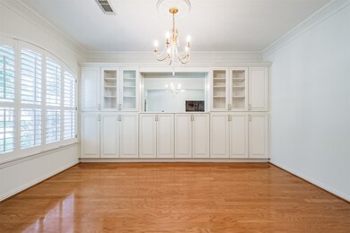 Formal dining room on the left of the entry with custom built ins.