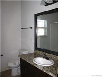 Hall bath has linen cabinet