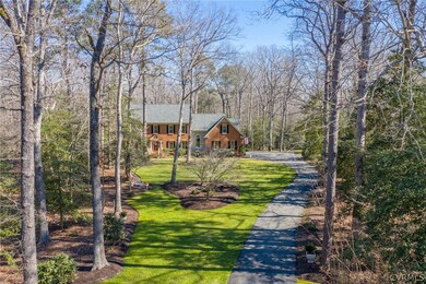 Long, paved driveway with ample parking near the h