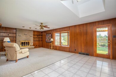 This huge space ends with the Family Room showing off a gas fireplace and bay window.
