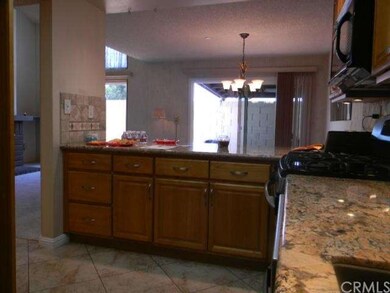 Kitchen towards dining area and patio
