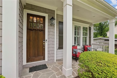 Entrance to property featuring a porch