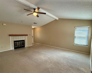 Unfurnished living room featuring a ceiling fan, 