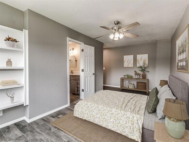 Bedroom featuring ceiling fan, dark hardwood / woo