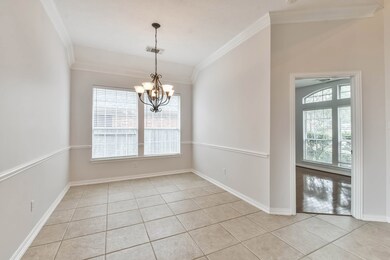 Dining Room next to kitchen with beautiful crown moulding.