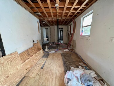 Facing Bathroom and Primary Bedroom.