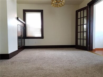 Dining room features built-in cabinet and french d