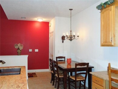Eat in kitchen area with updated chandelier!