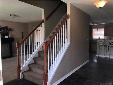 Stairs, Foyer, glimpse of Living Room to left, Kit