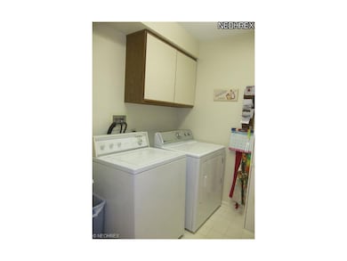 A first floor laundry room is conveniently located