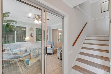Mudroom inside front door looking into bonus room